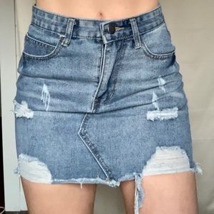 Distressed denim mini skirt